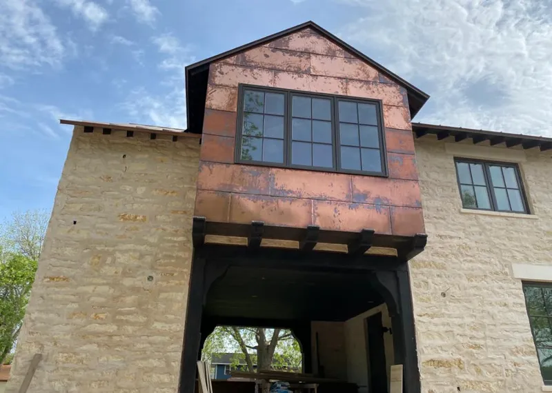 Copper metal panel facade on a stone building for Skylight Installation in Lake Havasu City